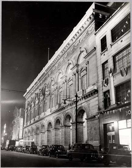 New Free Trade Hall, 1951, White, Daily Herald Archive, ©National Media Museum As the rebuilt Free Trade Hall is flood lit on the outside the Halle Orchestra and chorus rehearse for the fanfare for the Queen the following day.
