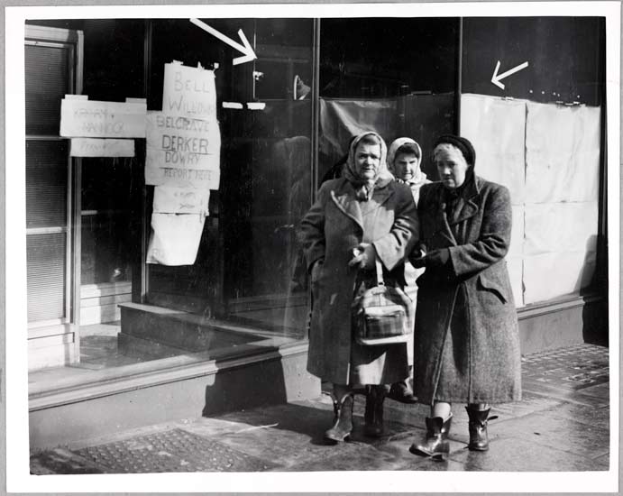 Women workers leaving Oldham labour exchange, 1952, White, Daily Herald Archive, ©National Media Museum Women cotton workers leave the Oldham Labour exchange after receiving pay. The notice on the window gives names of the mills for which payment is being paid on this day.