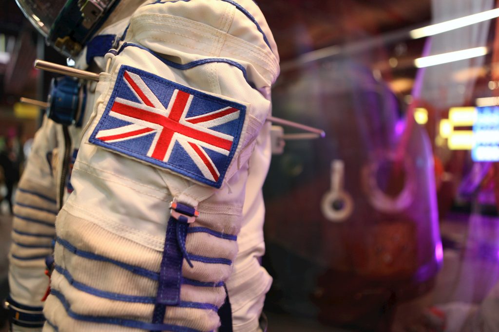 A detail from Tim Peake's spacesuit - the white sleeve showing the Union Jack flag on a patch
