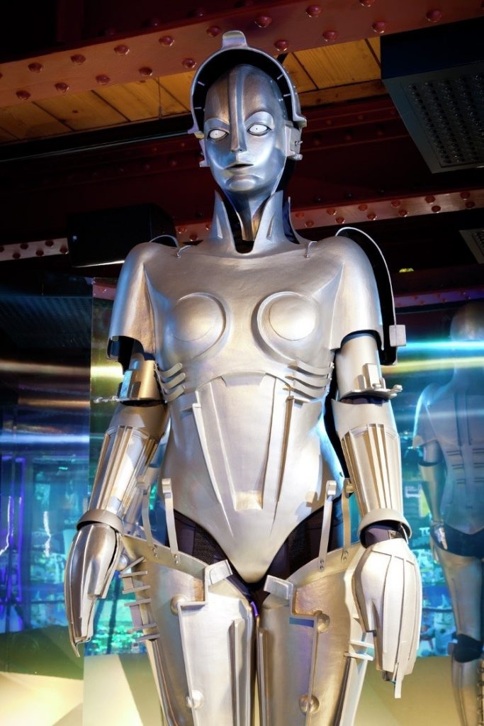 A silver robot with a female body shape