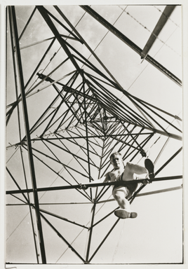 Photograph of a man climbing a pylon, c.1930 – don’t do this yourself!