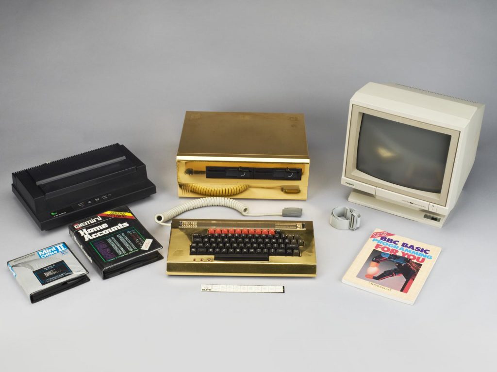 Gold plated BBC Micro computer with two 1-megabyte disc drives and keyboard, made by Acorn Computers Limited, Cambridge, England,1985. From 'The Micro User' competition.