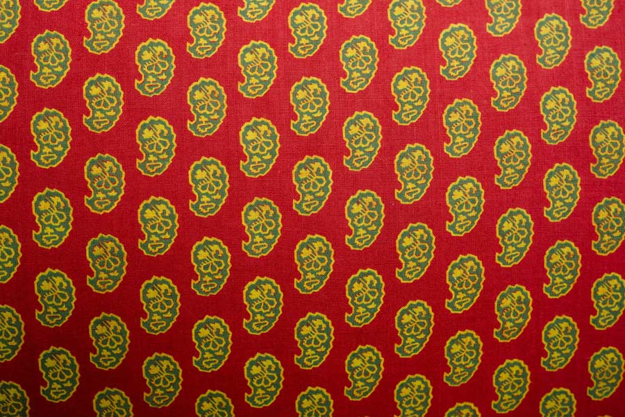 A red, green and yellow paisley pattern