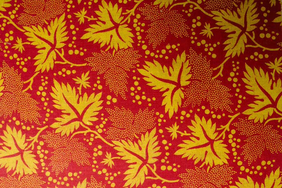 Red and yellow fabric with leaf patterns