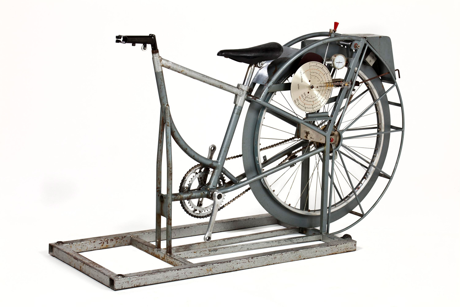 A bicycle-like machine, with no front wheel and fixed to a frame