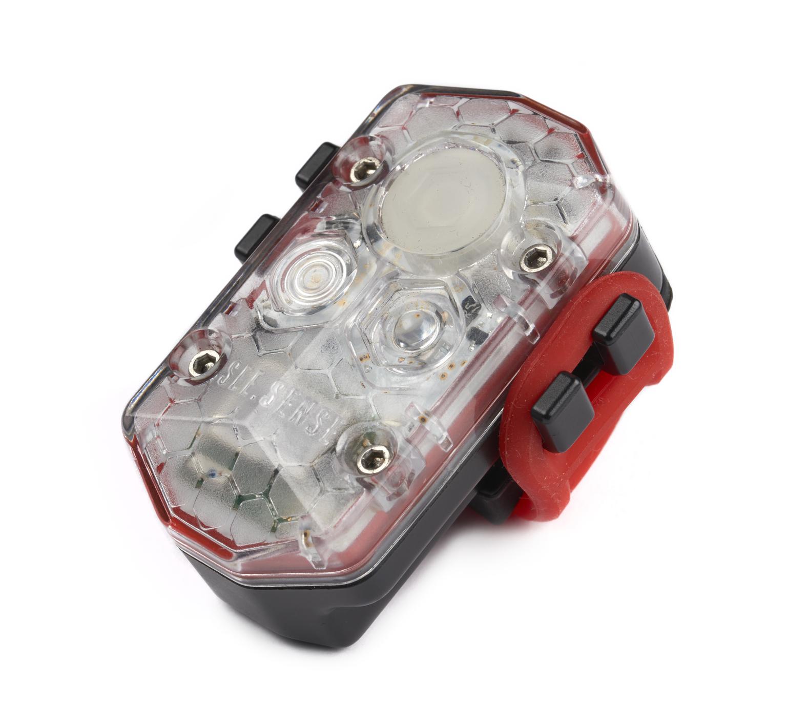 A white and red bike light