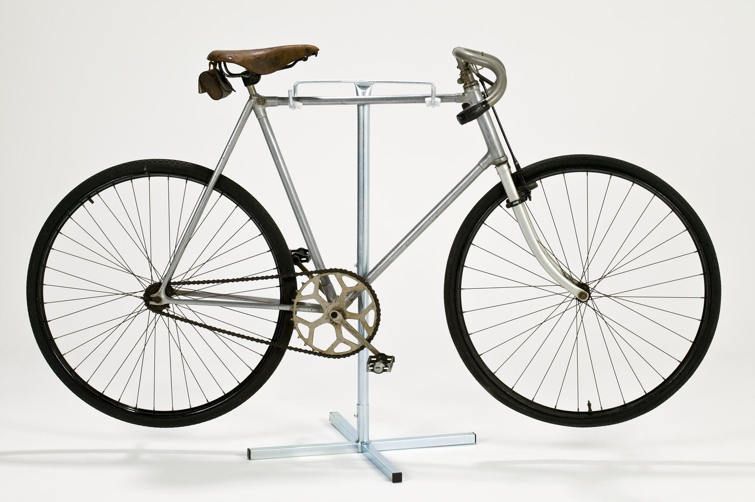An early aluminium framed bicycle on a rack
