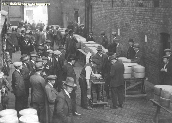 Black and white photo of people at a 1920s market