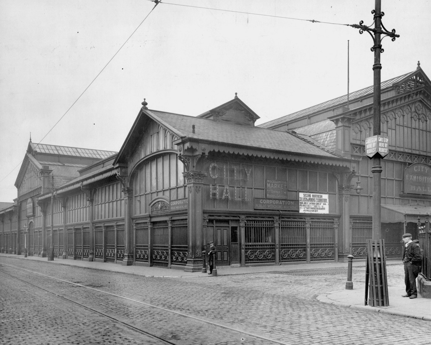 Black and white photo of the exterior of an old market hall