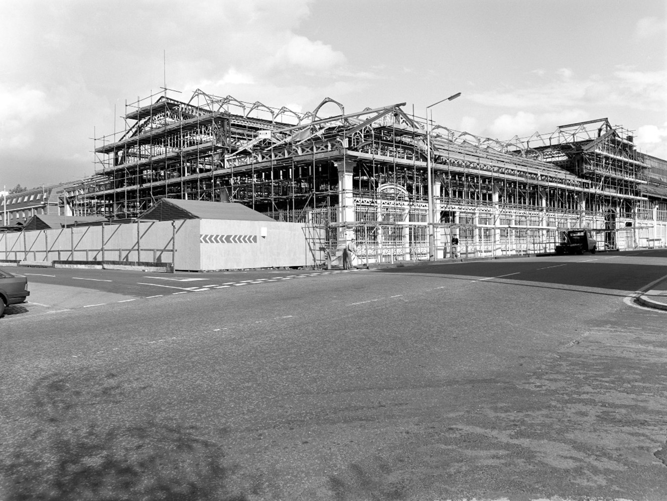 Black and white photo of an old market hall being renovated