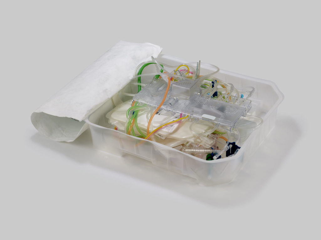 A plastic tray with different coloured wires coming out of it
