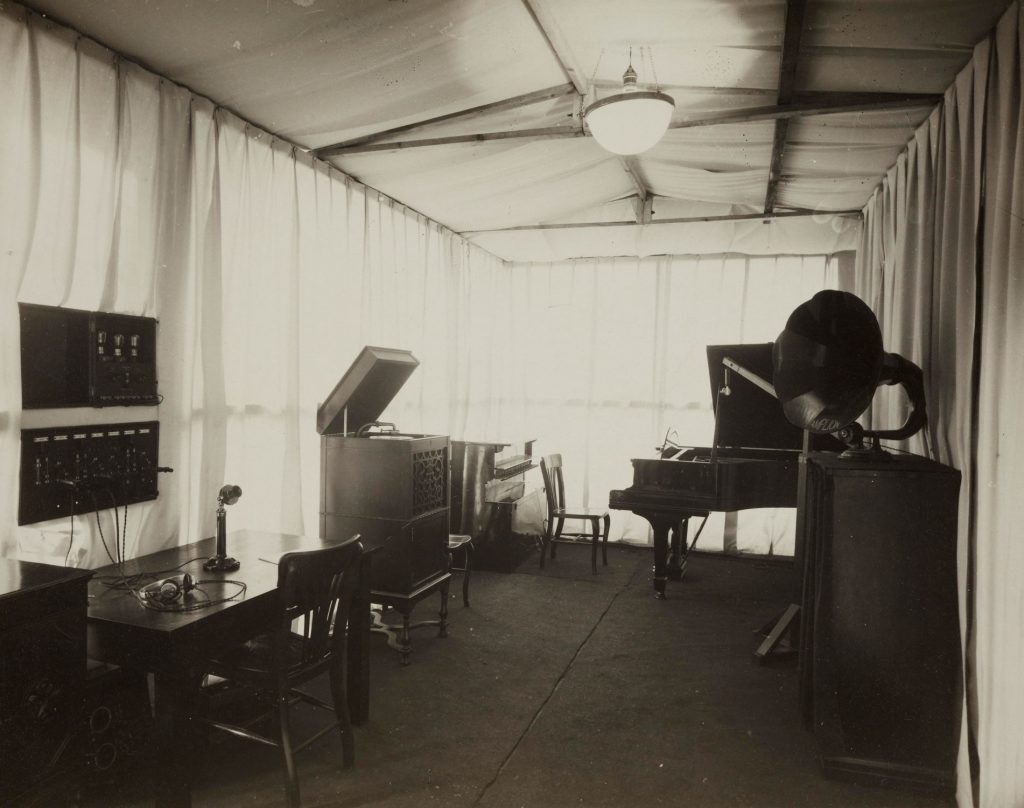 Black and white image of the interior of an old radio station
