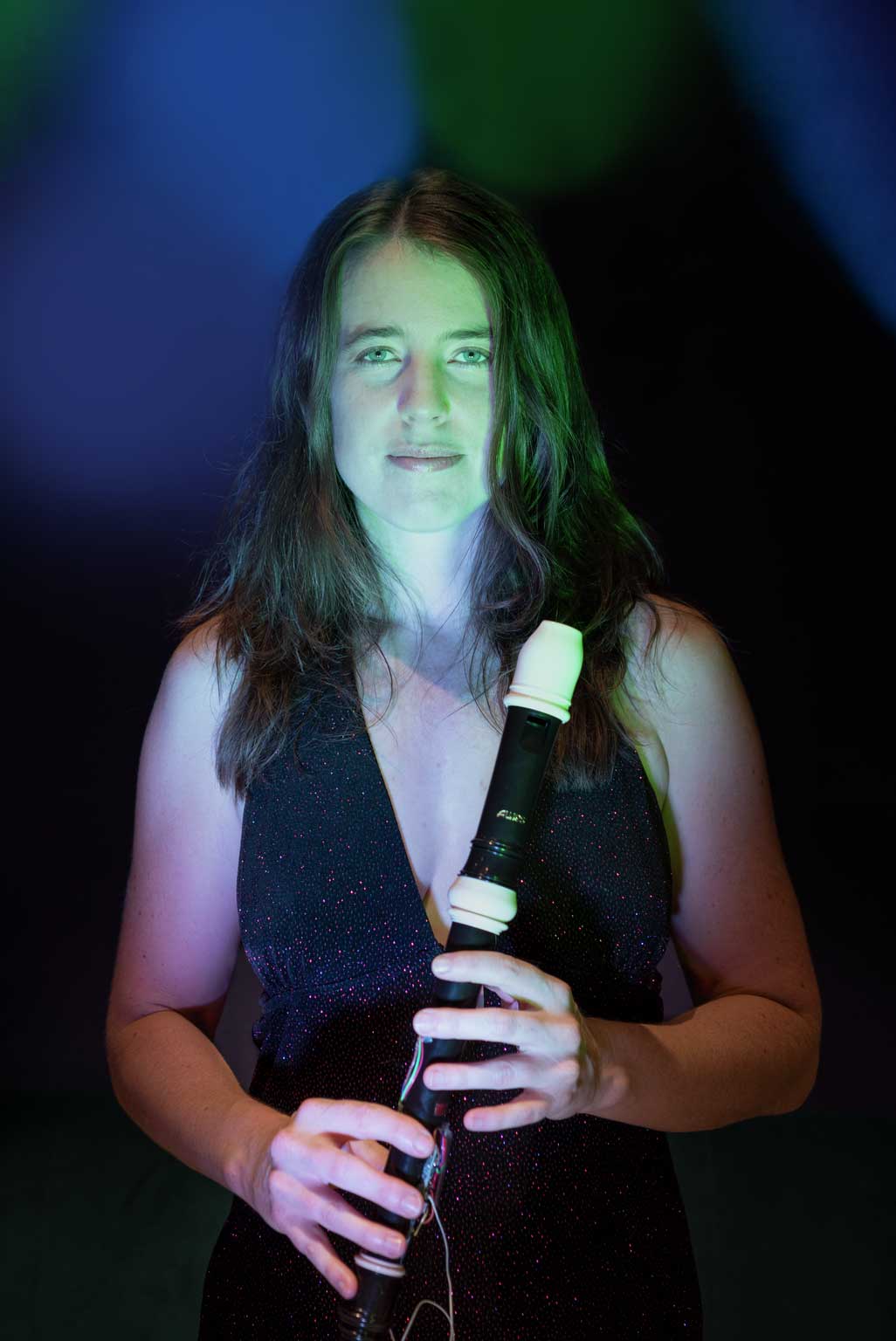 A woman holding a recorder