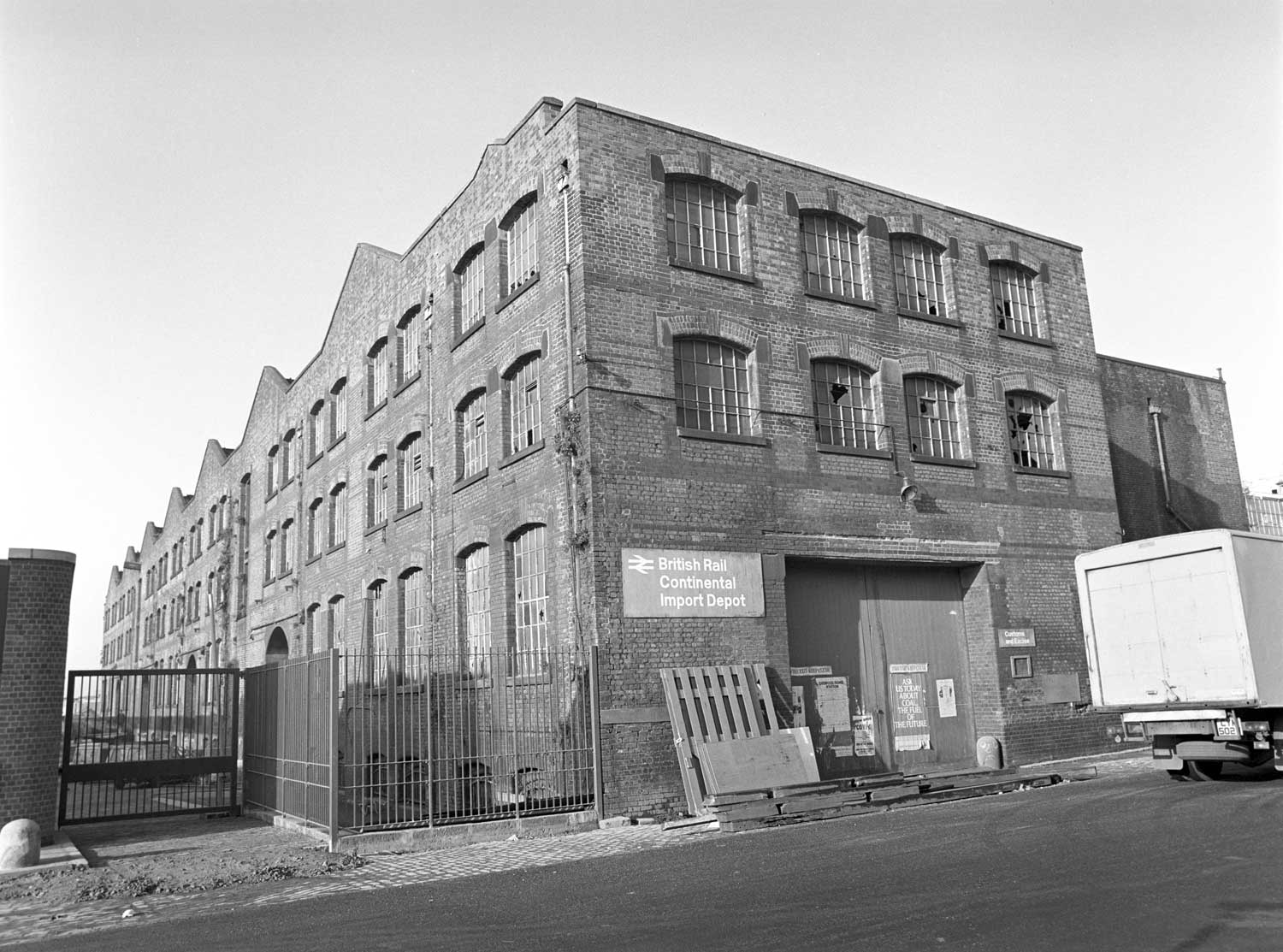 Black and white photo of a disused railway warehouse