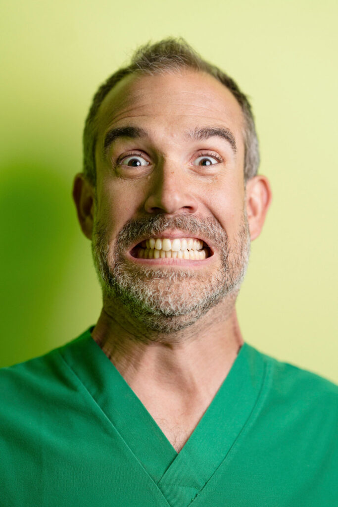 A man wearing green doctors' scrubs