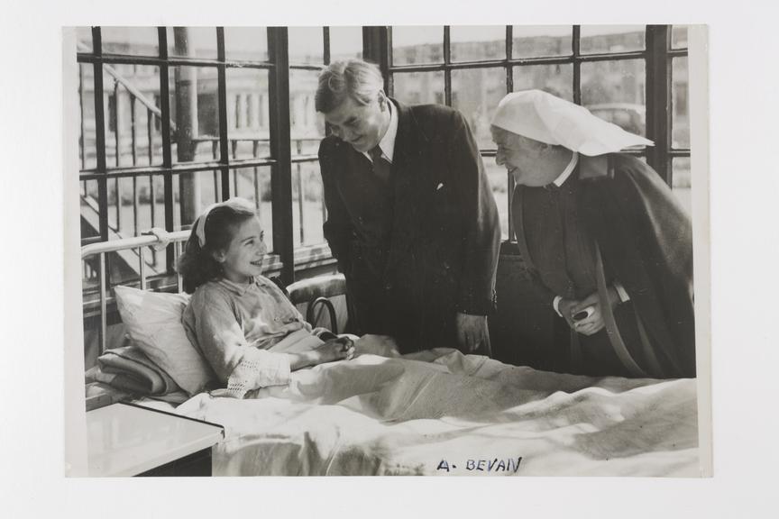 Aneurin Bevan visiting Silvia Beckenham, the first National Health Service (NHS) patient. With him is Matron Mary Nolan at Park Hospital, Davyhulme, Manchester.