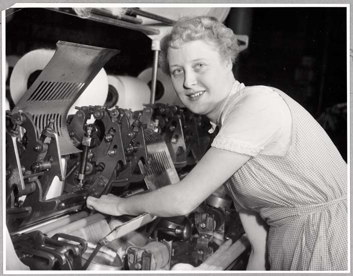 Mill girls rehearse mannequin display at Royton Co-op Hall, 1955, Roland Hicklin, Daily Herald Archive, ©National Media Museum Marion Gulley, a comber tenter at Delta Mill, Royton will later model rayon taffeta dress at the rehearsal.