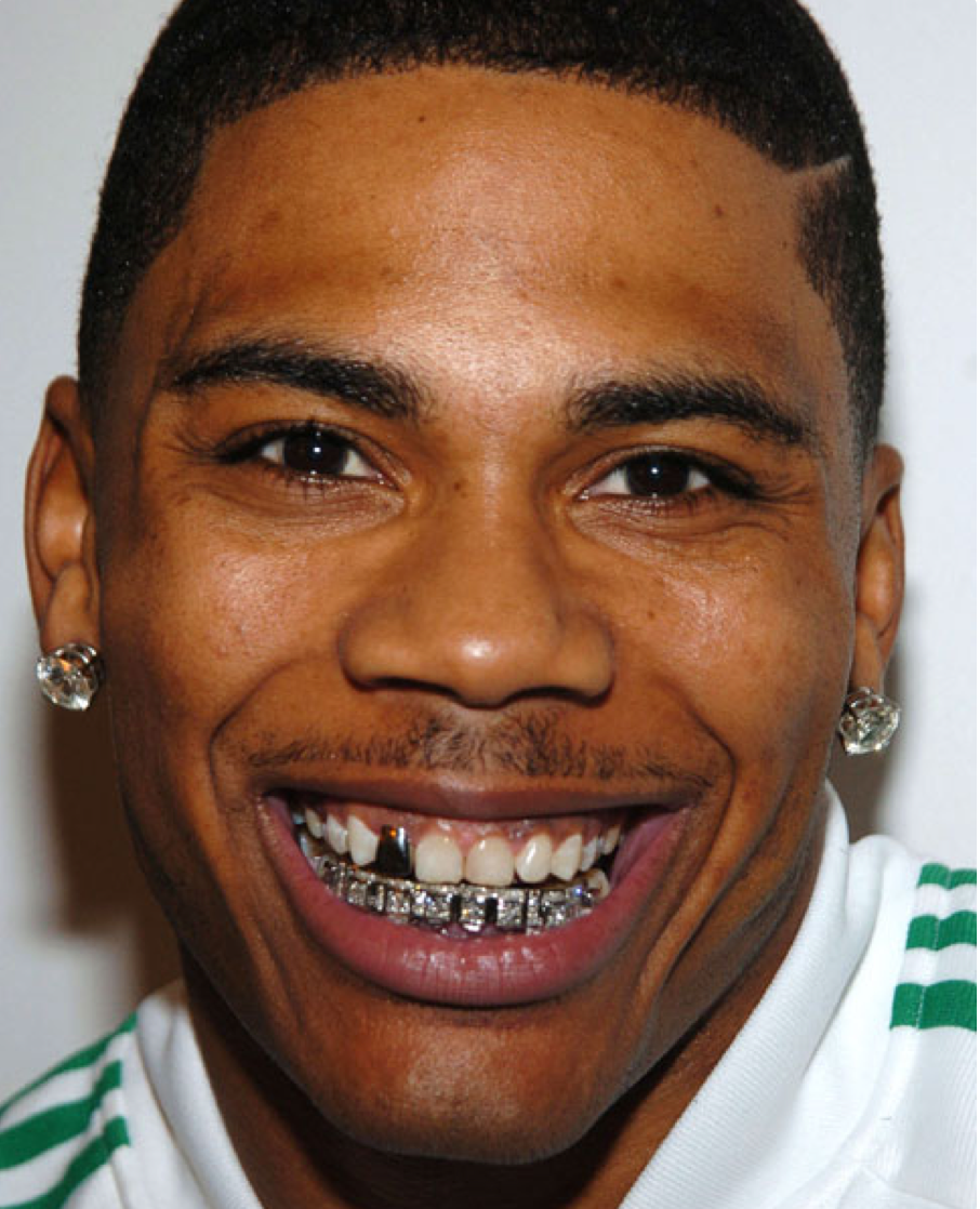 The rapper Nelly wearing a diamond 'grill' on his teeth 
