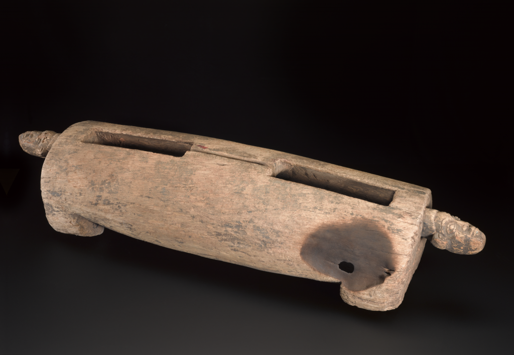 Talking drum, unknown maker, Cameroon, 1990-2010. Used for communication with villagers in the quarter of N'tabwe, in the village of Bafut near Bamenda, Cameroon. Drum plus two beaters.