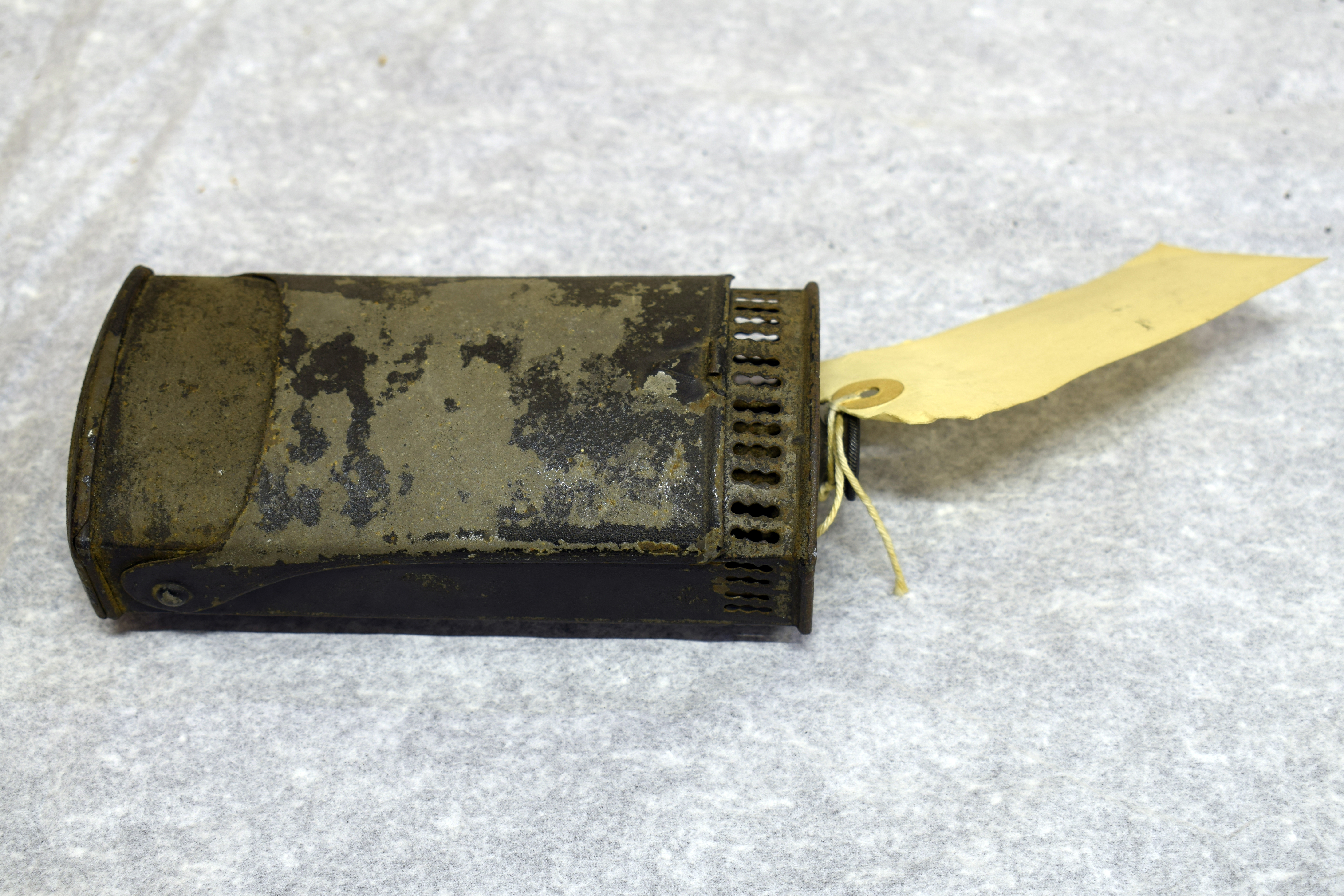 A black metal box with a lid at the front that would open