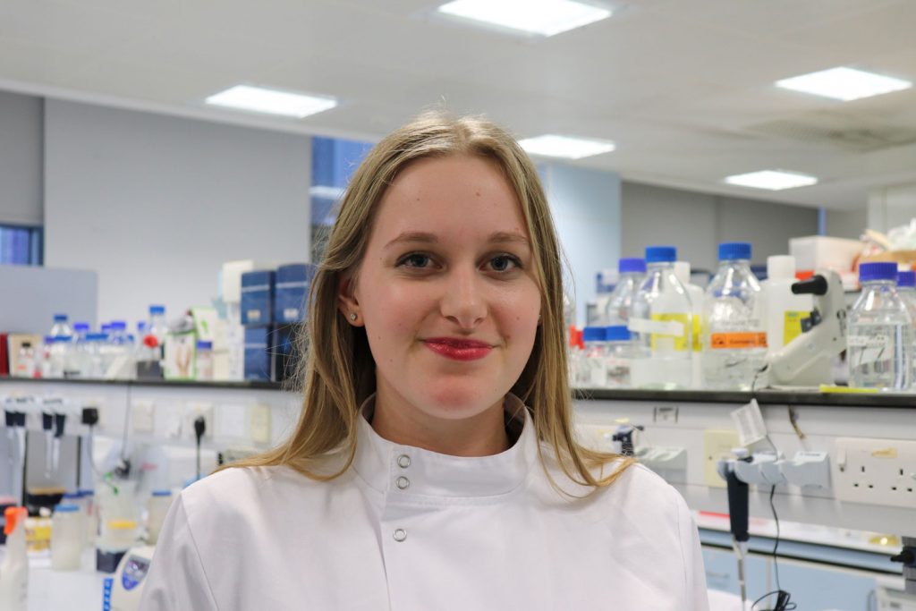 A woman in a lab coat in a laboratory