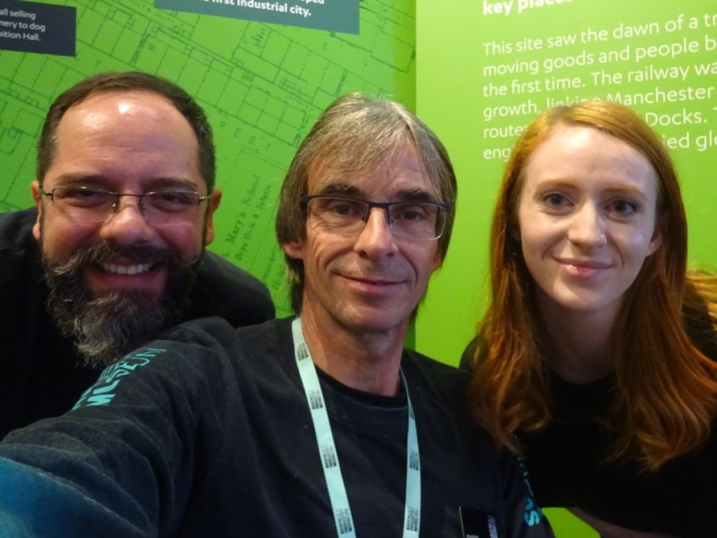 Two men and a woman taking a selfie