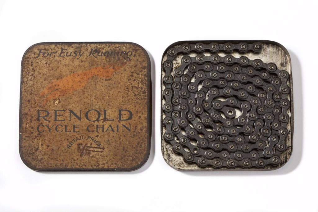An old bike chain in a tin