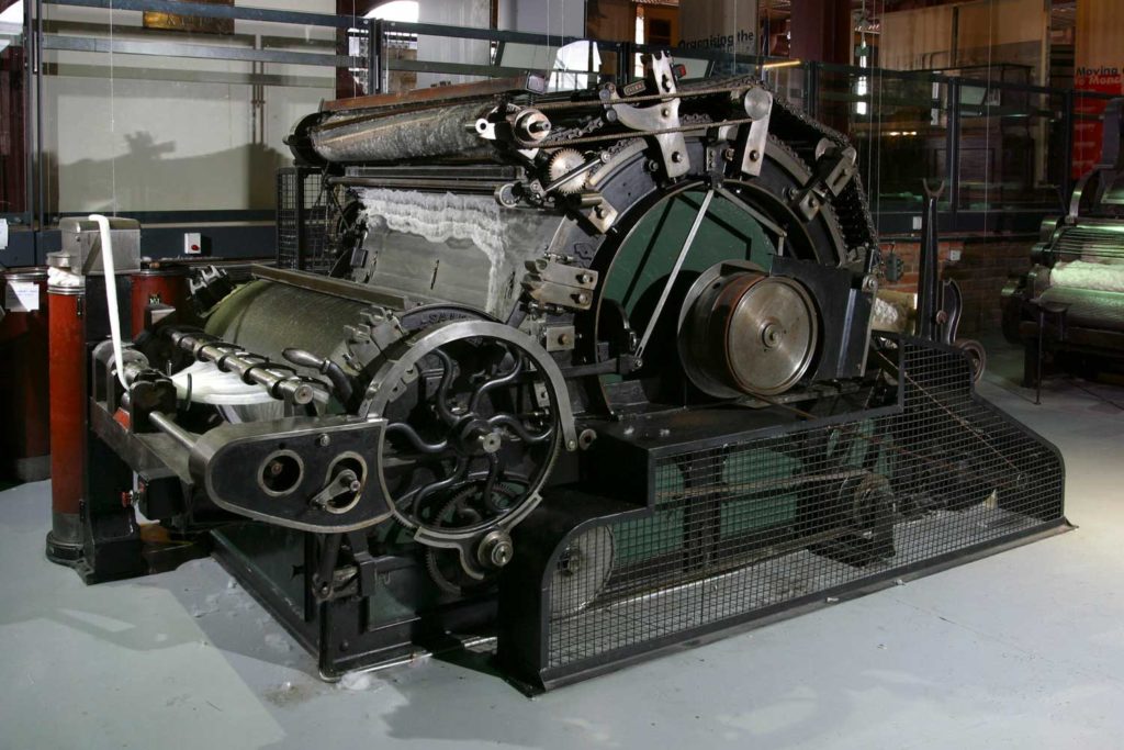 Old textile machinery on display in a museum