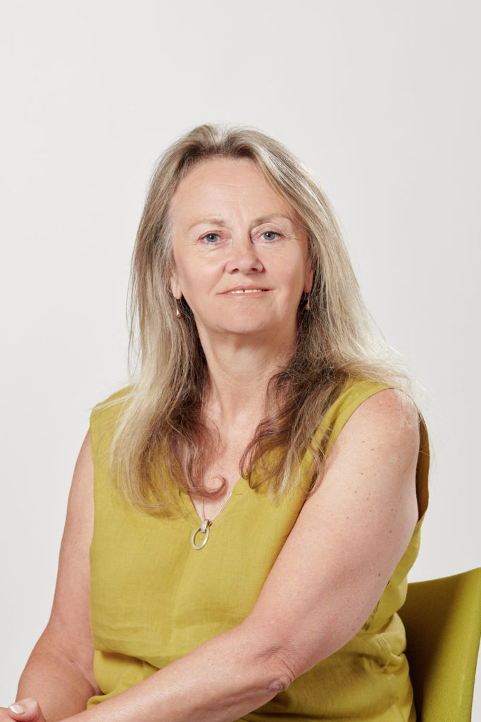 Portrait of a woman wearing a yellow dress