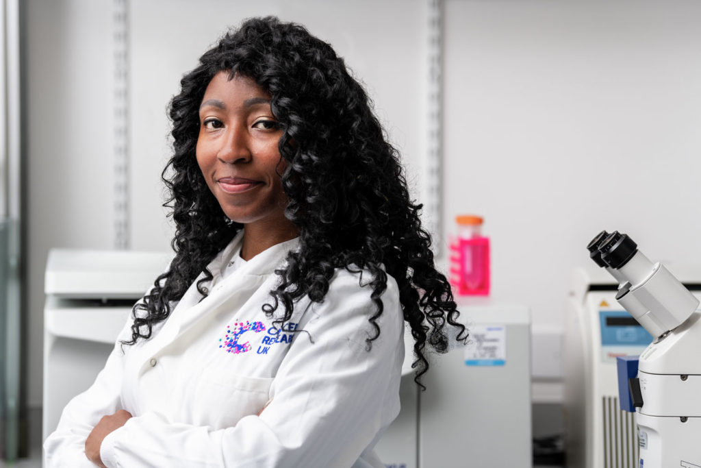 Portrait of a woman in a lab wearing a lab coat