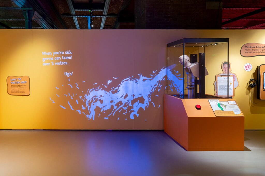 A model on display in a museum showing how far vomit travels