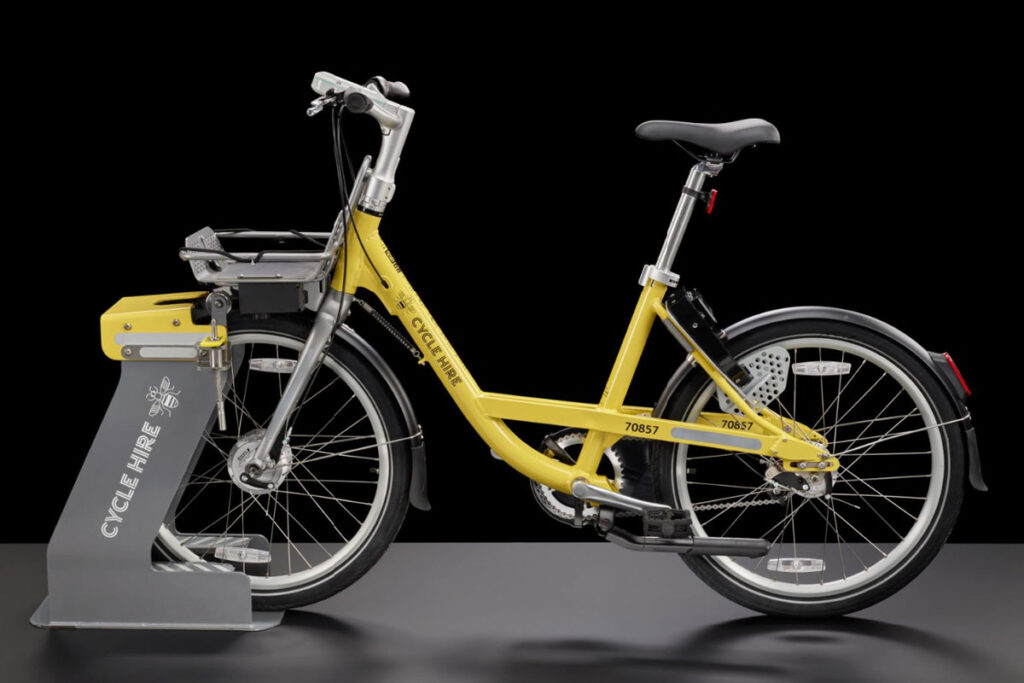 A yellow hire bicycle and docking station