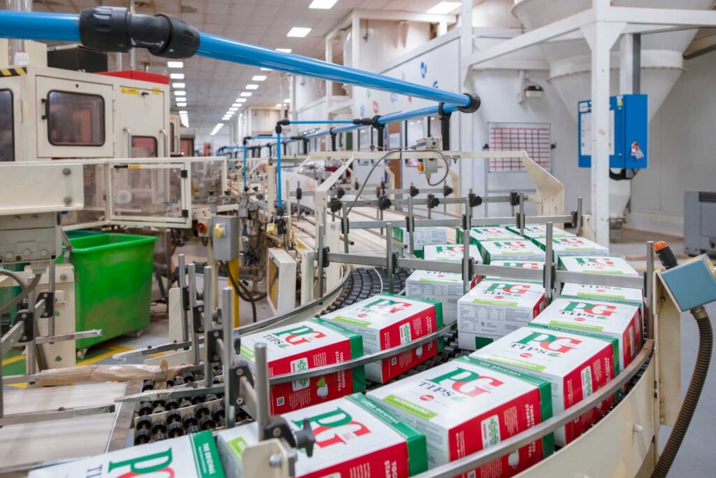 Boxes of pyramid teabags rolling off the production line