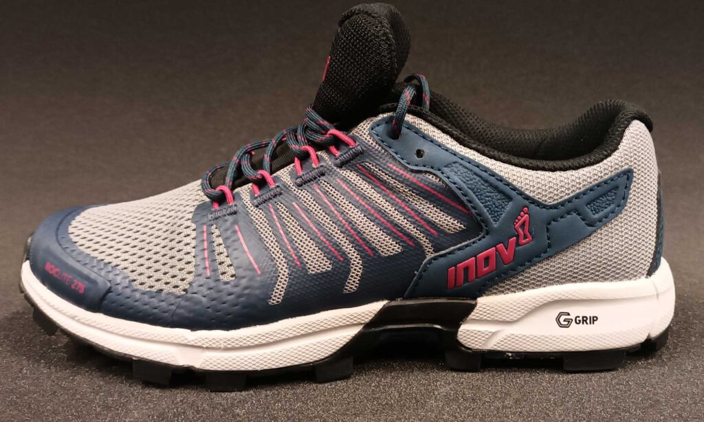 A pair of grey trainers.