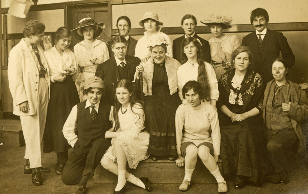 Sepia photo of the cast of a school play at an all-girls school